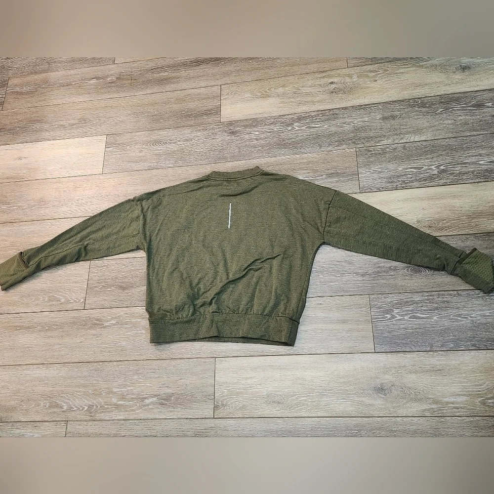 The Nike Running Women's Dri-Fit Crop Top Sweater in size Xsmall and olive green